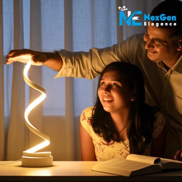 A spiral LED desk lamp being touched by a person while a younger person looks at it with a smile, book on the table
