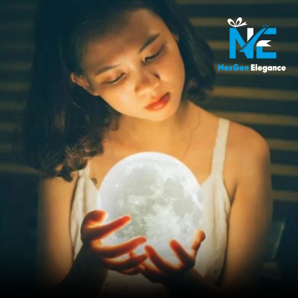 Woman gently holding a glowing white moon lamp with warm light illuminating her face, NexGen Elegance branding