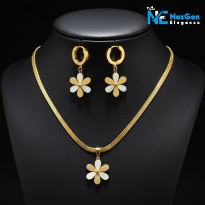 A studio shot of the full Golden Daisy Charm Set displayed together against a black background. The photo shows the gold-plated snake chain necklace with its matching flower pendant and the coordinating pair of hoop earrings with flower charms.