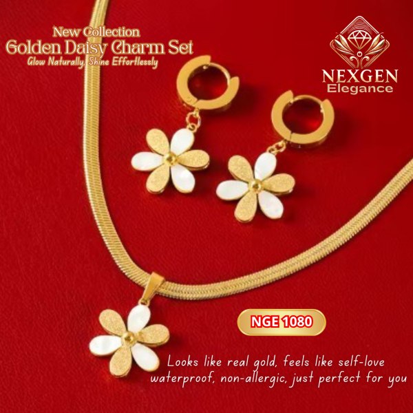 A close-up of the 18K gold-plated Golden Daisy Charm Set, featuring a necklace with a daisy pendant and matching daisy hoop earrings, displayed on a red background.