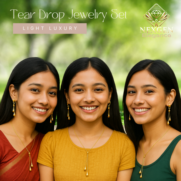 Three smiling young women with dark hair, looking directly at the camera, each wearing a golden tear drop necklace and matching dangle earrings, with a blurred green outdoor background.