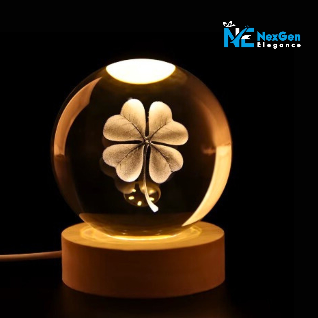 Glowing four-leaf clover crystal ball on wooden base, warm LED night lamp for room décor.