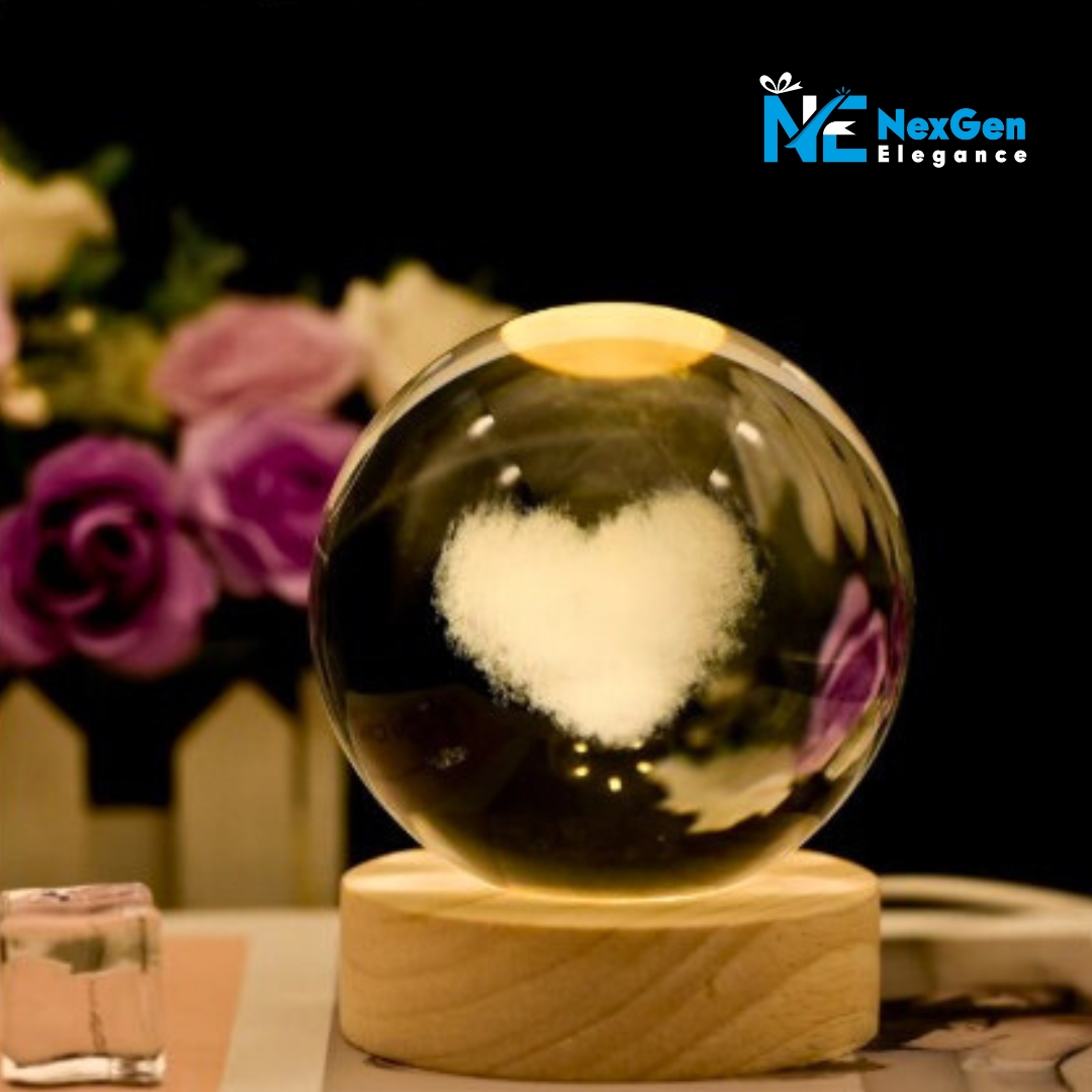 Luminous crystal ball with glowing white heart design on wooden base, romantic LED night lamp.