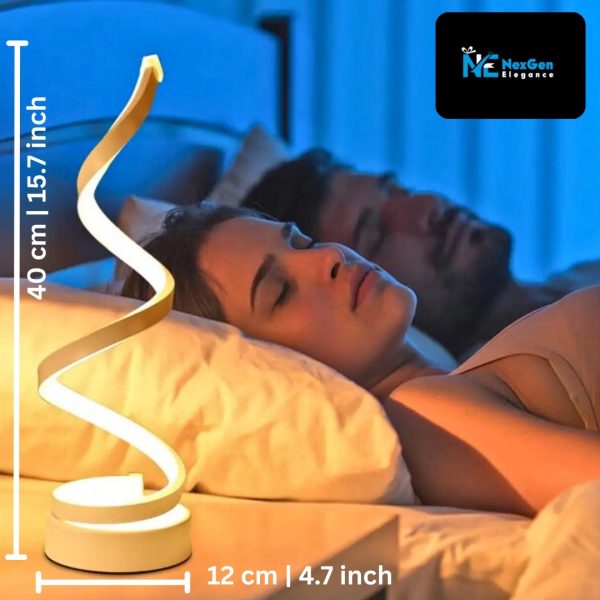 Spiral LED lamp lit on a bedside table next to a sleeping couple, with measurement lines showing 40 cm height and 12 cm width